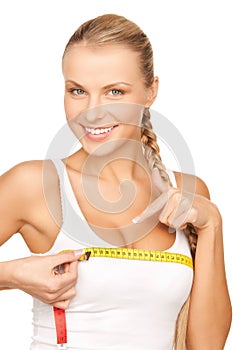Woman measuring her breast