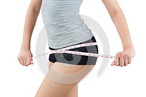 Woman measuring her hip- lose weight and healthy body concept- o photo