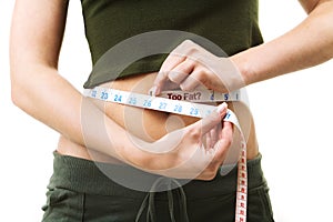 Woman measuring her waist