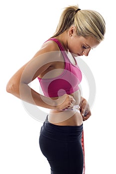 Woman measuring her waist