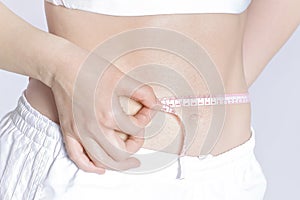 Woman measuring her waistline . Perfect Slim Body