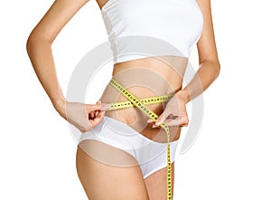 Woman measuring her waistline. Perfect Slim Body