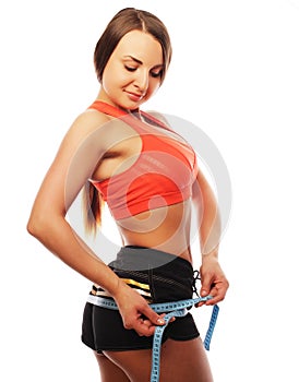 Woman measuring her waistline . Perfect Slim Body