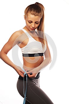 Woman measuring her waistline . Perfect Slim Body