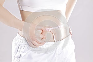Woman measuring her waistline. Perfect Slim Body. Diet.