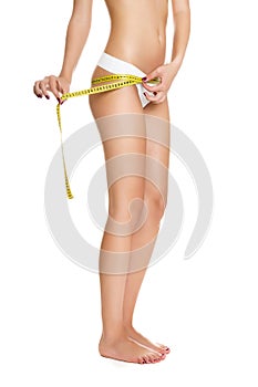 Woman measuring perfect shape of beautiful toned waist healthy