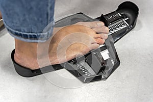 woman Measuring Shoe Size in storage. device determining length foot