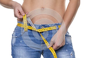 Woman with measuring tape before the next diet