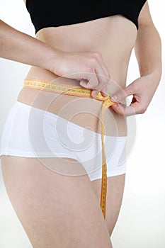 Woman measuring waist