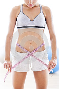 Woman measuring waist