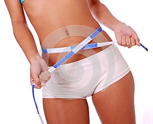 Woman measuring waist photo