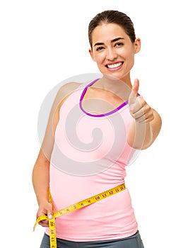 Woman Measuring Waist While Gesturing Thumbs Up