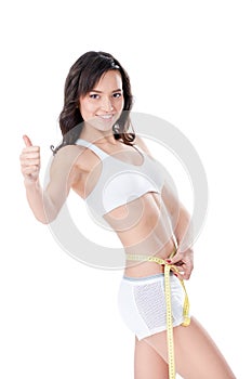 Woman measuring waist of perfect body