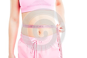 Woman measuring waist using a meter tape or ruler