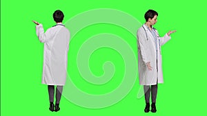 Woman medic does web advertisement against greenscreen backdrop
