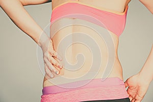 Woman with medical kinesio taping on back