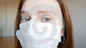 A woman in a medical mask