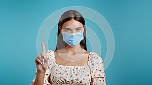 Woman in medical mask disapproving with no sign make negation finger gesture. Denying, Rejecting, Disagree, Portrait of