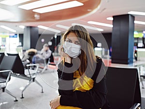 woman in medical mask passenger airport luggage