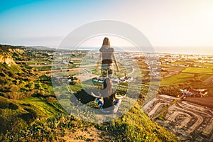 Woman meditates on the top of the mountain. Soul leaves body. Mind and spirit