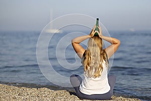 Woman meditating with beer
