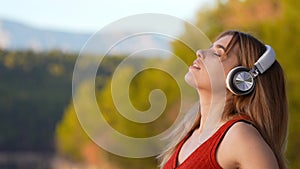 Woman meditating breathing with headset listening guide