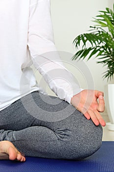 Woman meditating at home.