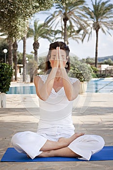 Woman meditating in lotus yoga