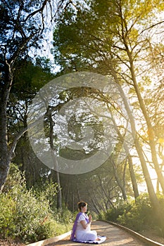 Woman meditating in the pathway