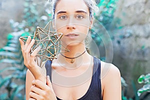 Woman meditating on sacred geometry