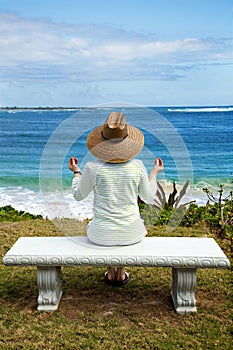 A Woman Meditating by the Sea