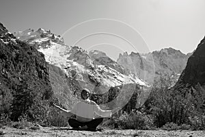 Woman meditating yoga in mountain gorge. Travel. Lifestyle. Relaxation. Emotional concept. Outdoor adventure. Harmony