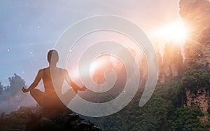 Woman meditating yoga at sunset mountains with nature. Outdoor s