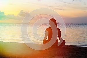 Woman meditation on the beach