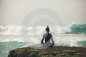 woman meditation at the seaside cliff edge