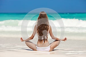 Woman Meditation At Tropical Beach