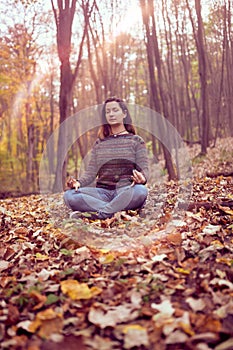 Woman meditationg in forest, Connected with Nature, Breathing ,Peace and Freedom concept