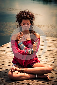 Woman in a meditative yoga position outdoor