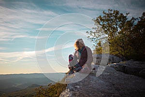 A woman meets the sunset in a beautiful place