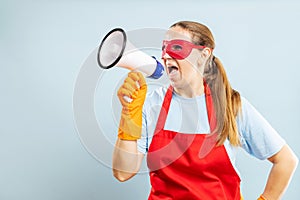 Woman with Megaphone Wearing Red Apron and Superhero Eye Mask
