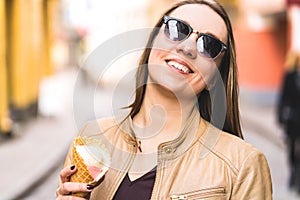 Woman with melted ice cream on nose. Happy smiling person eating