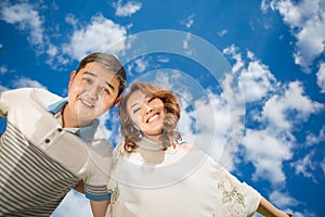 Woman men couple against blue sky