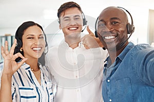 Woman, men and selfie of call center agents with headset, thumbs up and ok. Teamwork, support and help, friendly