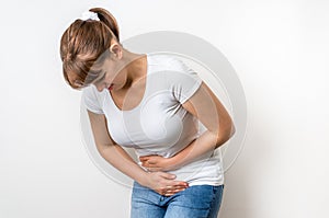 Woman with menstrual pain is holding her aching belly