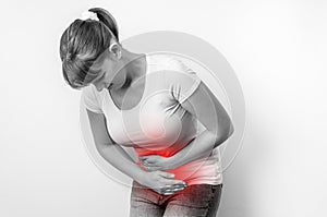 Woman with menstrual pain is holding her aching belly