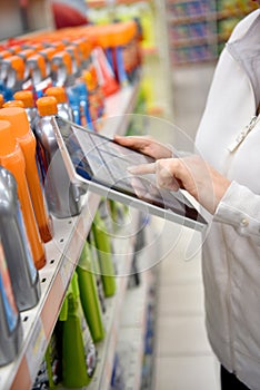 Woman merchandiser using tablet