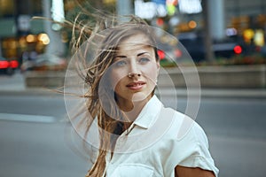 Woman with messy long hair on windy day