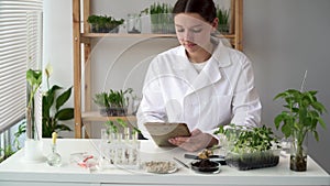 Woman microbiologist is using digital tablet computer. Medical scientist working on plant-based meat substitute for