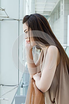Woman with mild stress, worry and unhappiness