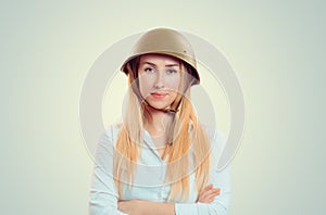 Woman in military cap of World War II with crossed arms